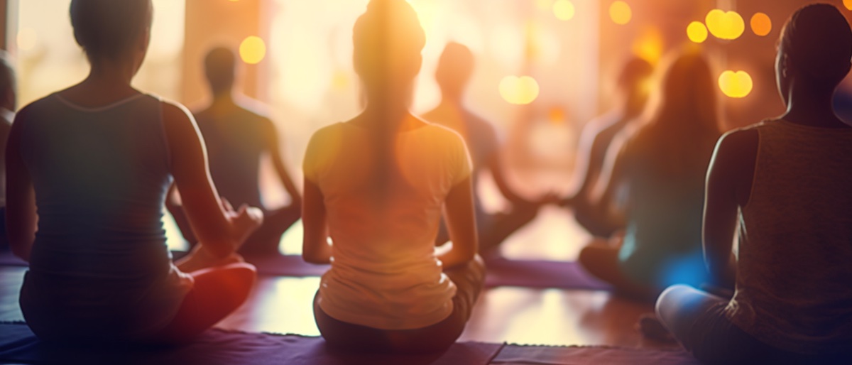 A group of people practicing yoga inside